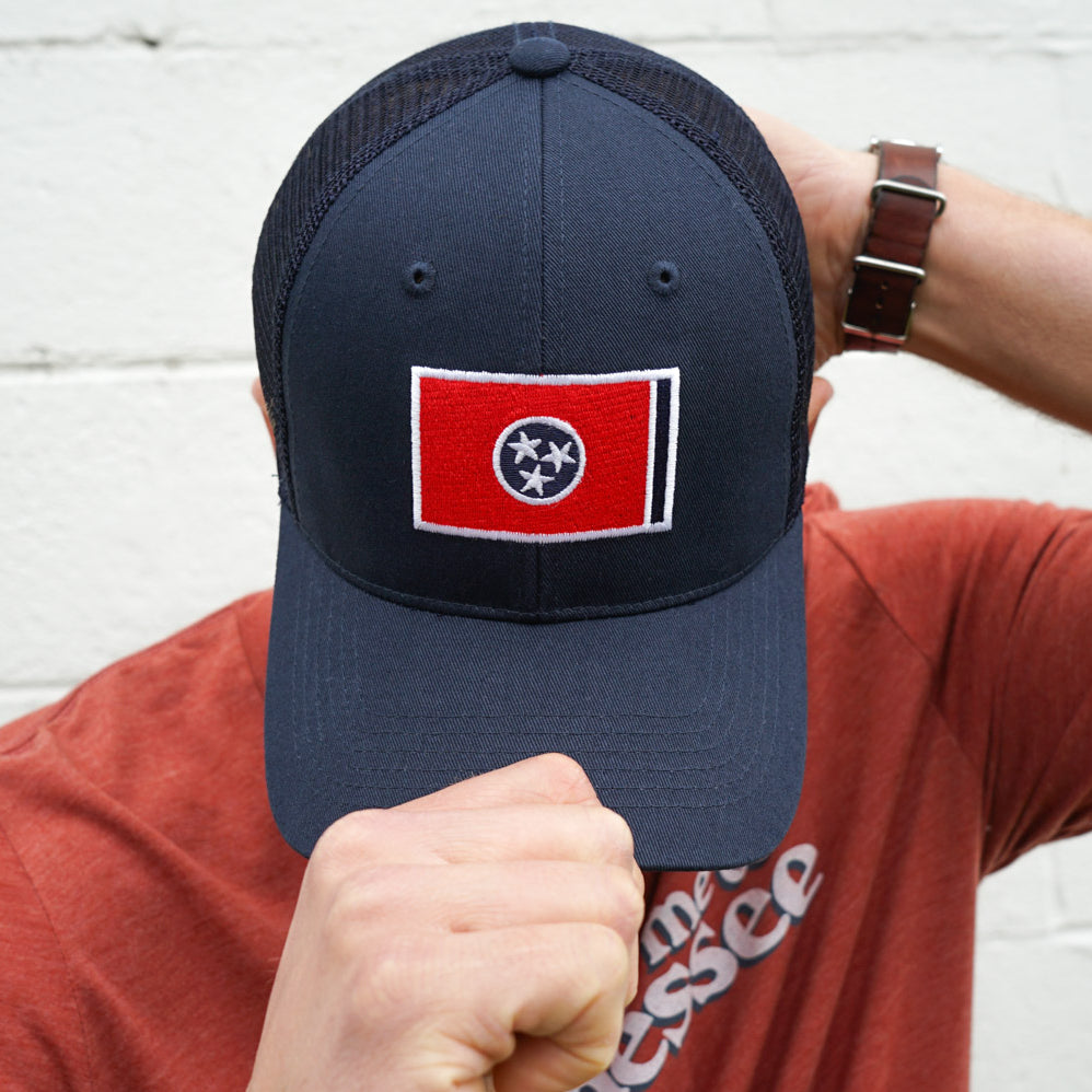 Volunteer Traditions Navy with Red Tennessee Flag Promesh Hat on head.