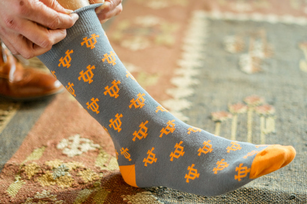 Volunteer Traditions University of Tennessee Licensed Socks. Grey interlocking UT Sock on foot.