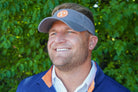 Volunteer Traditions Grey with Orange Tennessee Tristar Visor on head.