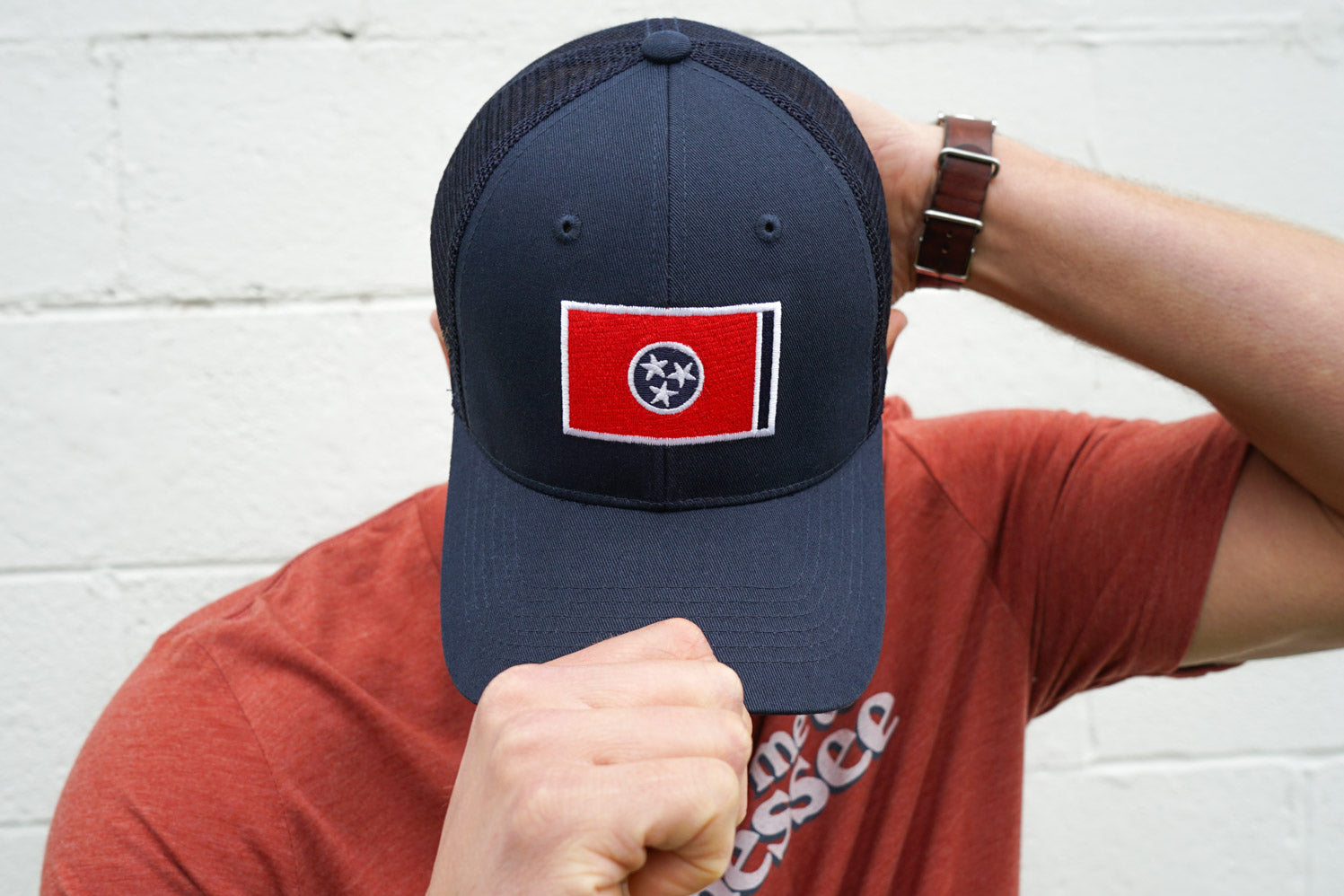 Volunteer Traditions Navy with Red Tennessee Flag Promesh Hat on head. 