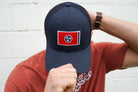 Volunteer Traditions Navy with Red Tennessee Flag Promesh Hat on head. 